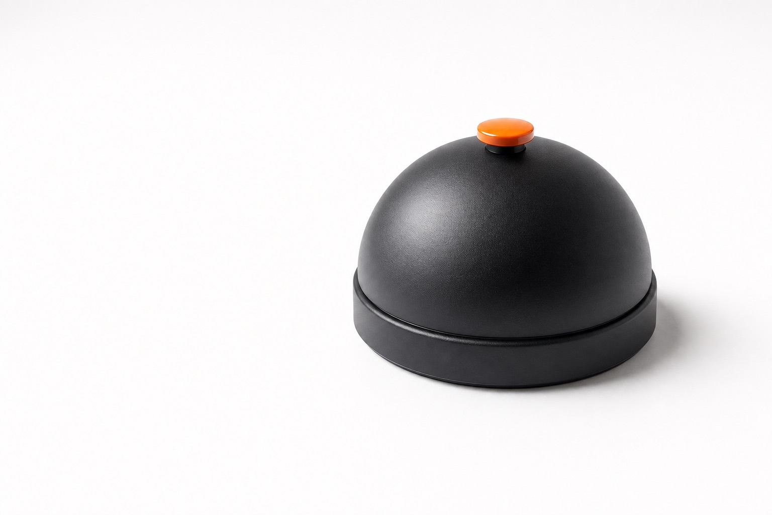 A black service desk bell with an orange button